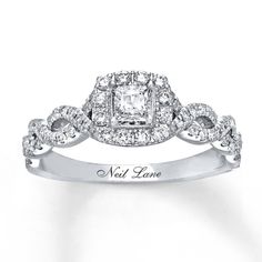 a diamond ring with the words neil lane engraved on it's side and surrounded by diamonds