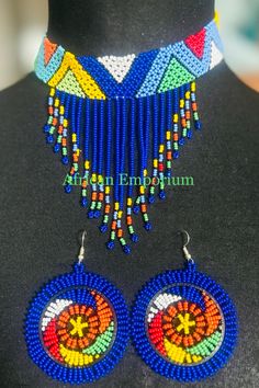 We love this Handmade Zulu necklace with matching earrings Multicolor Beaded Tassel Necklaces For Gifts, Blue Beaded Tassel Necklace For Festival, Bohemian Blue Dangle Beads, Blue Beaded Fringe Dangle Jewelry, Unique Beaded Fringe Jewelry As Gift, Blue Large Beaded Dangle Necklaces, Blue Beaded Dangle Necklace With Large Beads, Unique Beaded Fringe Jewelry For Gift, Blue Large Beads Dangle Necklace