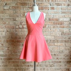 Bnwt Elizabeth & James Coral/Salmon Pink Skater Dress V-Neck, Sleeveless, Lined, Fit And Flare Skirt, Zipper At Center Back With Hook & Eye Flat Measurements: 33" Length, 15.5' Pit To Pit, 12.5" Waist, Waist Free New/Excellent Condition With Original Tags. Flawless. Runs Like A Small Sz2. Spring Coral Fitted Dress, Pink Fit And Flare Lined Dress, Pink A-line Mini Dress For Brunch, Pink V-neck Fit And Flare Dress, Pink Fit And Flare V-neck Dress, Pink Fit And Flare Cocktail Dress, Fitted Peach Cocktail Dress, Pink Skater Dress, Elizabeth James