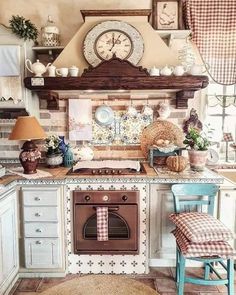 a kitchen with an oven, stove and clock on the wall above it's counter