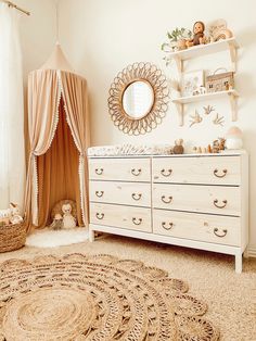 a baby's room with a crib, dresser and teddy bear