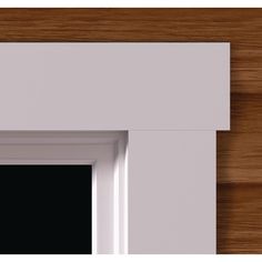 a close up view of a door frame with wood in the background and white trim