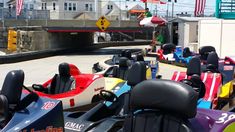 many bumper cars are lined up on the street