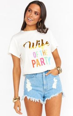 a woman wearing a white shirt with the words duke of the party printed on it