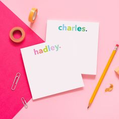 two cards with the words charles and hadley written on them next to some pencils