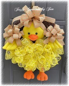 a yellow ducky wreath hanging on the front door