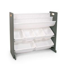 a green and white shelf with six trays on it's sides, one is empty