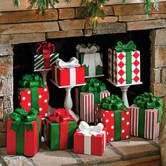 christmas presents are stacked on top of each other in front of a fireplace mantel