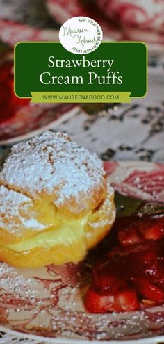 strawberry cream puffs on a plate with powdered sugar