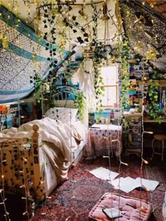 a bedroom with lots of plants growing on the ceiling and bed in front of it