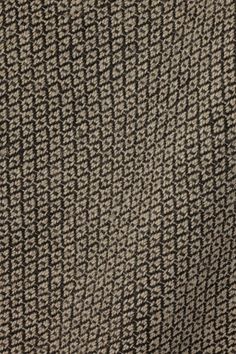 a close up view of a black and white tweed fabric