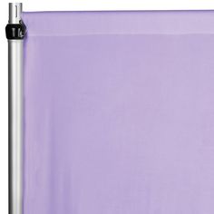 a purple sheet is hanging on a metal pole