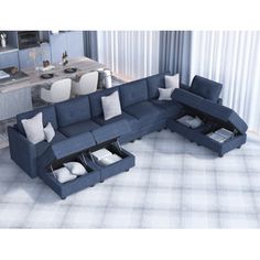 a blue sectional sofa sitting on top of a rug