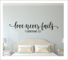 a bedroom wall decal with the words love never falls