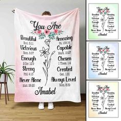 a woman is holding up a blanket with the names of her loved ones on it