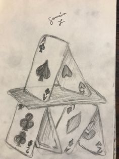 a pencil drawing of playing cards stacked on top of each other in the middle of a table