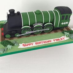 a birthday cake shaped like a train engine