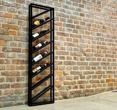 a wine rack on the side of a brick wall