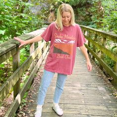 Let's go on an adventure to the National Parks! This bookish tee features an oversized design of the Smoky Mountains on a brick red Comfort Colors tee. It's so comfy, high quality & made to last with a soft, vintage look and feel! You will not want to take it off. Features 100% ring spun cotton Soft washed garment dyed fabric Tee runs slightly big and has a wide boxy throw-back 90s style cut For size guide, view comfort colors tee Pictured: I'm 5'5" & wearing a size large. Casual Red T-shirt For Outdoor Activities, Casual Fall T-shirt For Outdoor Activities, Casual T-shirt For Outdoor Fall Activities, Casual T-shirt For Outdoor Fall Events, Casual Outdoor Fall T-shirt, Casual T-shirt For Fall Outdoor Activities, Casual Relaxed Fit T-shirt For Hiking, Comfort Colors Tee, 90s Style