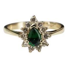 May Birthstone Pear-shaped Diamond Ring, Pear-shaped Diamond Ring For May Birthstone, Vintage Yellow Gold Emerald Ring, Pear-shaped Emerald Ring With Diamond Accents For Anniversary, Victorian Green Diamond Ring, Vintage 14k Gold Green Emerald Ring, Vintage Green Diamond-cut Rings, Elegant Yellow Gold Tourmaline Emerald Ring, Tiny Gold Hoop Earrings