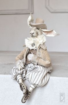 a stuffed animal sitting on top of a white table