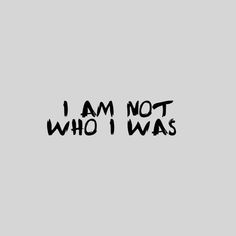 the words i am not who i was written in black ink