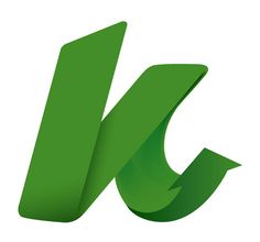 the letter k is made up of green curved paper and has an arrow on it