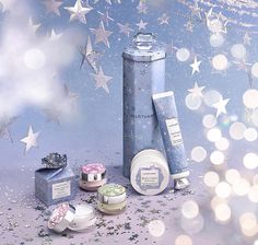 various items are displayed in front of a blue background with stars and confetti