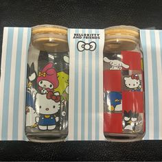 two hello kitty and friends tumblers are on display