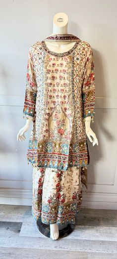 Cream and Blue floral sharara with embroidered neck line with crepe duppatta  Product details  Fabric - silk blend Embroidery - floral  Color - Cream & Blue  Size - XL bust - 42" - 44" kurtha length- 36" Sherara length- 41" Semi-stitched Sharara With Printed Motifs And Straight Kurta, Wedding Sharara With Printed Motifs In Mulmul, Wedding Mulmul Sharara With Printed Motifs, Eid Floral Embroidered Palazzo Set, Eid Sharara With Printed Motifs, Eid Sharara With Printed Motifs In Mulmul, Unstitched Multicolor Embroidered Raw Silk Sharara, Festive Sharara With Floral Print And Straight Kurta, Festive Floral Print Sharara With Straight Kurta