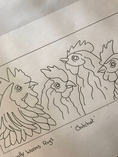 an image of three chickens drawn on paper