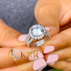 a close up of a person holding a ring