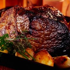 a close up of a plate of food with meat and potatoes