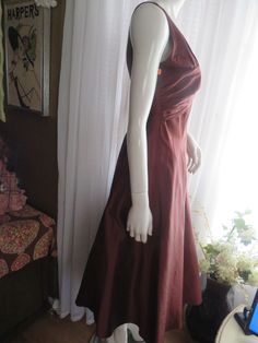 "1990's sleeveless, deep-V front/back bronze/dark brown cocktail dress, by Nicole Miller of New York, in a size 6. Dress has a big flared circle skirt, with attached under slip of silk/netting, back nylon zipper, outer dress fabric is silk. Front bodice is in a deep-V cleavage in a large bust bow look, as well as a deep-V bodice back. Dress is in great condition, Bust 32 1/2\", Waist 28\". PRICE IS $179.00------SALE FINAL/AS IS/NO RETURNS." Brown Cocktail Dress, Brown Cocktail, Outer Dress, Brown Flares, Flowing Dresses, Back Dress, Nicole Miller, Circle Skirt, Large Bust