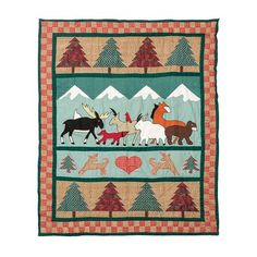 a quilt with horses and deers on it