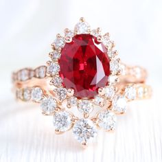 Large Oval Ruby and Diamond Bridal Ring Rose Gold Halo Wedding Set | La More Design Unique Ruby Engagement Rings, Oval Ruby Engagement Ring, Ruby Engagement Ring Set, Ruby Ring Set, Halo Wedding Set, Ruby Wedding Rings, Gift Wishlist, Rose Gold Halo, Traditional Engagement Rings