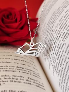 This beautiful necklace is a special and unique piece of jewel for you your best friends and a perfect gift for all books lovers. It is made entirely of solid stainless steel in the shape of a open book. The chain is resizable/adjustable. Stainless steel never fade or change color. Product details: Material: Stainless Steel Color: Silver Size: 20mm * 15mm Chain lenght: 45cm Book Necklace, Book Jewelry, Her Book, Custom Book, Open Book, Story Book, Beautiful Necklace, Book Lovers Gifts, Book Lover