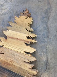 several pieces of wood stacked on top of each other in the shape of a christmas tree