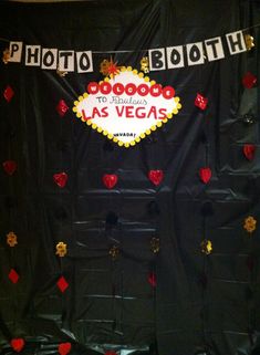 a black backdrop with red and gold confetti on it that says photo booth to las vegas