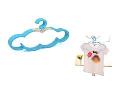 a pair of scissors and a t - shirt hang on a clothes rack next to an image of a cloud