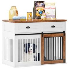 a dog is sitting in his kennel with food on the top and other items