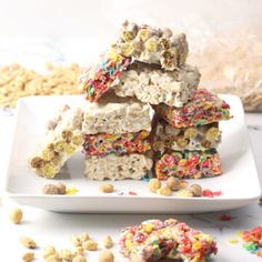 a white plate topped with cereal bars and sprinkles