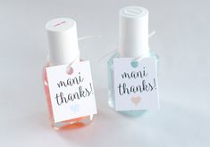 two small bottles with thank tags attached to them