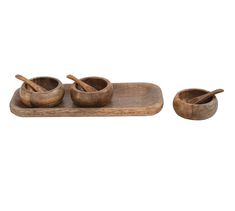 three wooden bowls and spoons on a tray