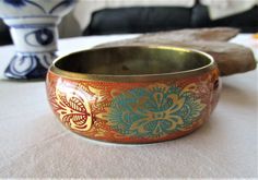 Vintage brass bangle enamel bangle hippie bangle boho bangle Indian brass bangle vintage 80s bracelet retro jewelry gift. This is a really well crafted piece of very retro, very Hippie, very Boho, jewelry. Made in the 80s, it is a very beautiful item in very good condition and with a lot of good karma. It is made of brass with coloured enamel and lacquered for a beautiful glossy finish. It is hollow and has a cute heart cut out of the inside surface.   I really love this impressive bangle and it Boho Bangle, Heart Cut Out, Brass Bangle, Bangles Indian, Enamel Bangle, Retro Jewelry, Vintage Brass, Jewelry Gift, Bangle Bracelets