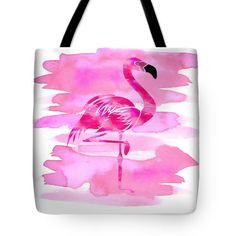 a pink flamingo standing in the water tote bag