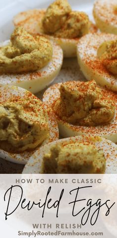 deviled eggs on a plate with sprinkles and seasoning in the middle