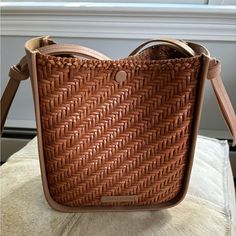 This Crossbody Bag Is Barely Used. Has A Lot Of Room. Snap Closure. Crossbody Strap Is Adjustable. Leather Is In Perfect Condition. Chic Tan Bag With Woven Leather, Chic Tan Woven Leather Bag, Elegant Woven Leather Crossbody Bucket Bag, Woven Leather Bucket Bag For Daily Use, Tan Woven Leather Bag For Everyday Use, Elegant Rectangular Tan Bucket Bag, Designer Natural Bag For Everyday Use, Rectangular Woven Leather Bucket Bag For On-the-go, Rectangular Woven Leather Satchel For Errands