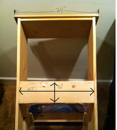 a wooden step stool with measurements for the seat and foot rest on carpeted floor