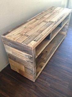 a wooden shelf sitting on top of a hard wood floor